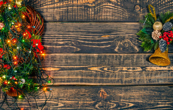 Christmas wooden background with garlands and a place to copy.