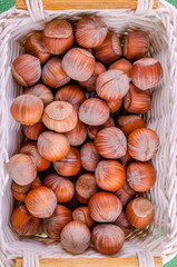 Hazelnuts in a shell in a basket on the table.