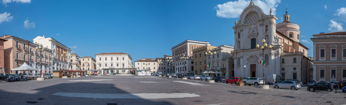 Extra wide angle view of the beautiful Piazza Duomo in L'Aquila with historic buildings and churches