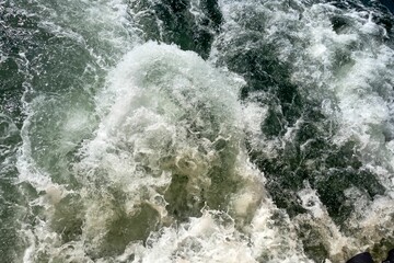 Powerful waves shot from a fast moving boat
