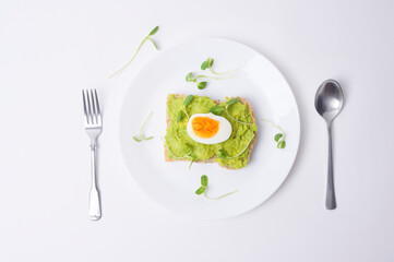 Fototapeta na wymiar Bread with avocado , vegetables fruit and egg on white background , Healthy breakfast concept