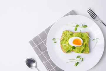 Bread with avocado , vegetables fruit and egg on white background , Healthy breakfast concept