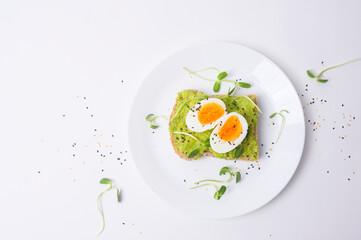 Bread with avocado , vegetables fruit and egg on white background , Healthy breakfast concept