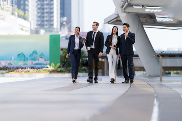 Business people walking and talk to each other in front of modern office