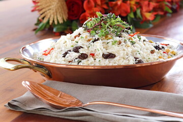 Party rice with raisins and pieces of tomatoes and spices