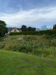 Northern Europe. Old house in the botanical garden next to a modern building