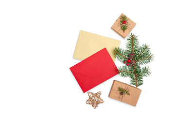 Red and golden envelopes, Christmas tree green branch and craft gift boxes isolated on white background flat lay.