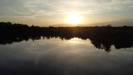 Fototapeta na wymiar sunset over small lake