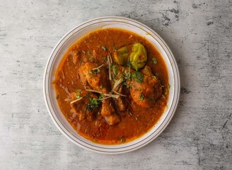 chicken red karahi served in a plate isolated on background top view of indian and pakistani desi food