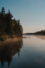 Fototapeta na wymiar Foggy morning lake