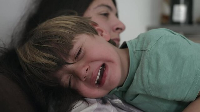 Tearful crying child. Mother consoling sad little boy. Kid in crisis cries