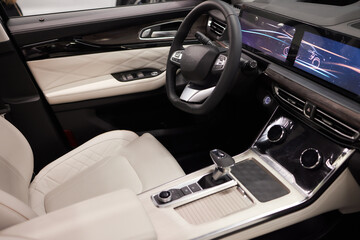 Obraz na płótnie Canvas Modern suv car interior with leather panel, multimedia and dashboard.