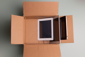 Donate old computers and used electronics to charity. Old digital tablet computers collected in...