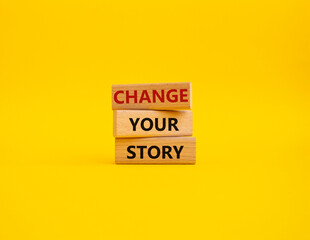 Change your story symbol. Concept word Change your story on wooden blocks. Beautiful yellow background. Business and Change your story concept. Copy space