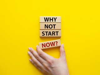 Why not start now symbol. Concept words Why not start now on wooden blocks. Beautiful yellow background. Businessman hand. Business and Why not start now concept. Copy space.
