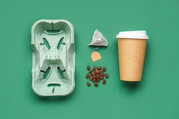 Composition with holder, paper cup, coffee beans and tea bag on color background