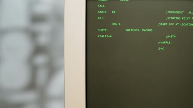 Retro pc with loading code console, programmer making scripts, green basic screen, Old computer studio close-up, Desktop vintage retro wave display, late 90s PC.