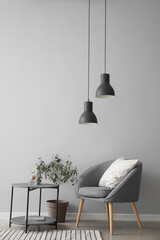 Interior of modern living room with armchair and table