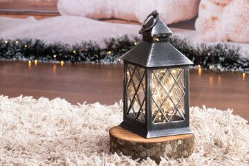 Christmas lantern with fairy lights on shag rug