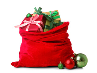 Santa Claus bag full of gifts and decorations on white background