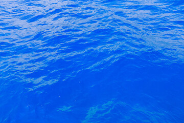Obraz premium Very nice sea water background or backdrop with selective focus. Small waves of natural water surface texture.