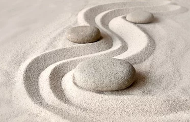 Fotobehang Zen garden meditation stone background with stones and lines in sand for relaxation balance and harmony spirituality or spa wellness © Belight