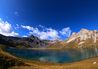 Fototapeta na wymiar Lago di Rims mountain lake located in Swiss Alps in Val Müstair, Switzerland