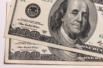 One hundred dollars banknotes on one dollar background, money and finances 