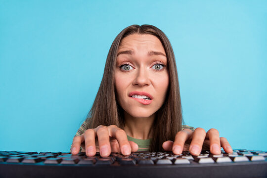 Closeup photo of young pretty amazed nervous girl typing chatting keyboard computer problems deadline programmer isolated on blue color background