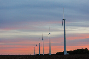 Wind turbines Energy production using clean and renewable energy sources, agricultural fields. a place for text, engineering and lectures without an eco trace. ecology