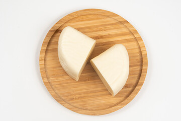 Minas half-cured cheese on a bamboo tray,