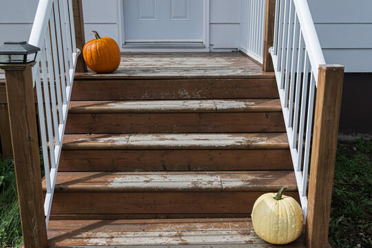 Two Pumpkins top and bottom of stairs
