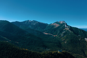 Obraz premium mountain landscape, Tatra mountains panorama, Poland. Tatra National Park. Panorama of the surrounding area Swinica, Tatra Mountains. Zakopane town in Poland. panorama from peak - Slovakia Tatras.