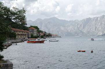 Red boat in Kotor Bay, Montenegro, stock photo