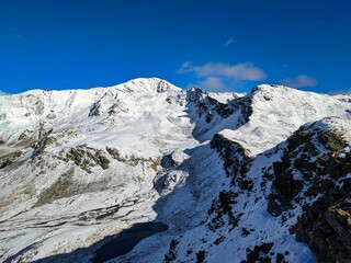 Fototapeta na wymiar mountain pischa above davos klosters. Freshly snowed peak. High quality photo