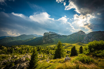 Looming thunderclouds create a beautiful evening atmosphere in the Dolomites. Falzarego pass, Dolomites, South Tirol, Italy, Europe.