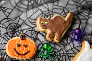halloween sweet baked treats cookies cakes shapes pumpkin black cat with hat ghost  - 541079098