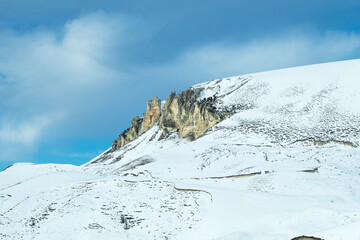 View of a small snow-covered chalk mountain