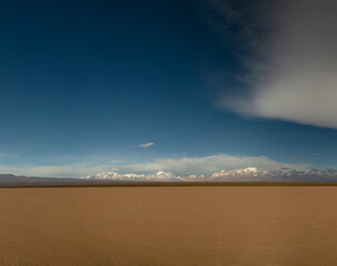 View of the arid desert in Barreal Blanco, in San Juan, Argentina. The Andes mountains in the...
