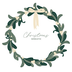 Christmas wreath with viscum and white bow.