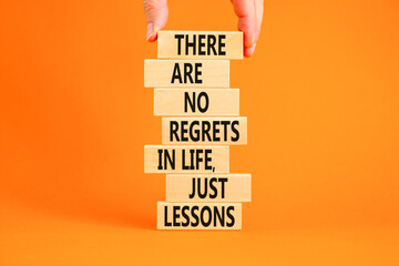Regrets or lessons symbol. Concept words There are no regrets in life just lessons on wooden blocks...
