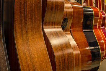 Several acoustic guitars in close-up. Musical Instrument Store