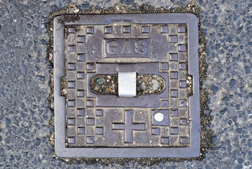 cap for a gas connection on an asphalt road in germany