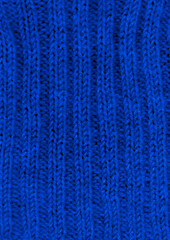 Organic knitted background with detail wool threads.