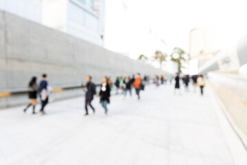 Blurred view of Seoul street with modern buildings, pavements and stylish people walking. Can be used as background. De focused image of capital of south Korea.