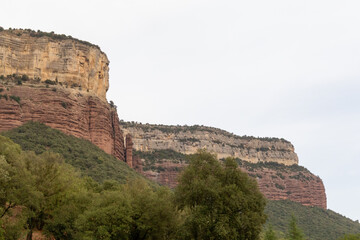 Red cliff near a reservoir