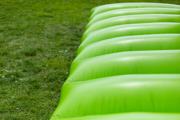 Inflatable design. Trampoline for jumping. Green material. Air three designs.