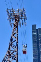 Looking up at a Roosevelt Island Tramway car and tower in NYC