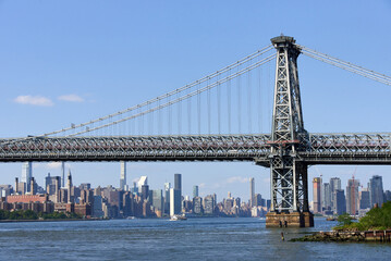 Looking north at Brooklyn side of the Williamsburg bridge and the the skyline of Midtown Manhattan,...