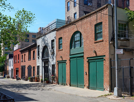 Old brick stables in Hunts Lane in Brooklyn Heights, NYC. These buildings are now garages or residential houses.